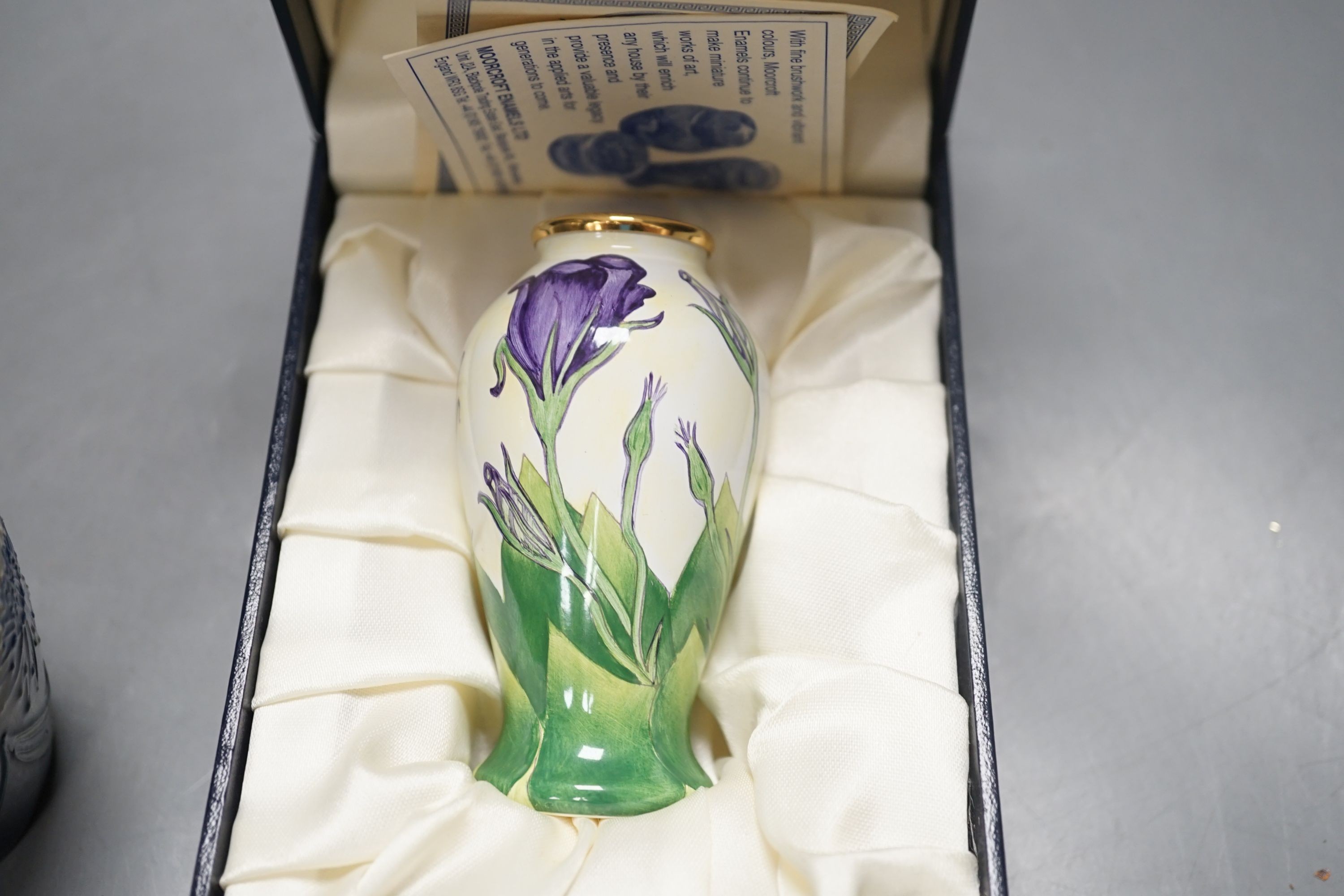 Moorcroft pottery vase, dated 2010, a smaller vase dated 2011 and a Moorcroft enamel Lisianthus vase, limited edition 93/100; signed J Hunne. All three boxed.